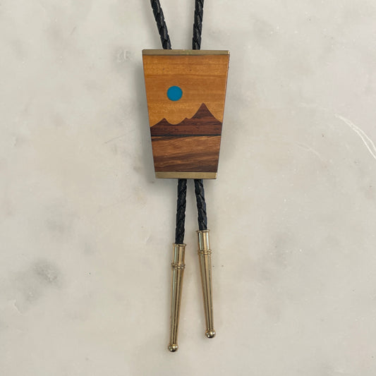 Wood + Brass Desert Scene Bolo [1984]